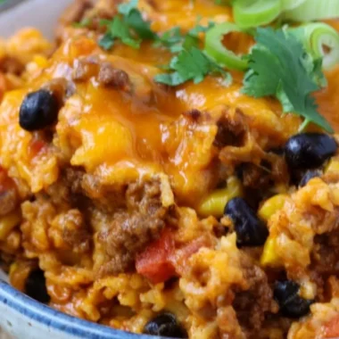 Delicious beef enchilada casserole with rice served in a baking dish