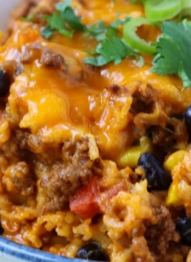 Delicious beef enchilada casserole with rice served in a baking dish