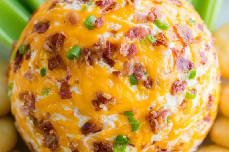 Delicious Bacon Ranch Cheeseball with bacon, herbs, and spices on a serving platter.