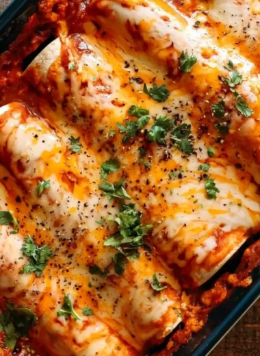Delicious cozy bean and cheese enchiladas served with fresh toppings