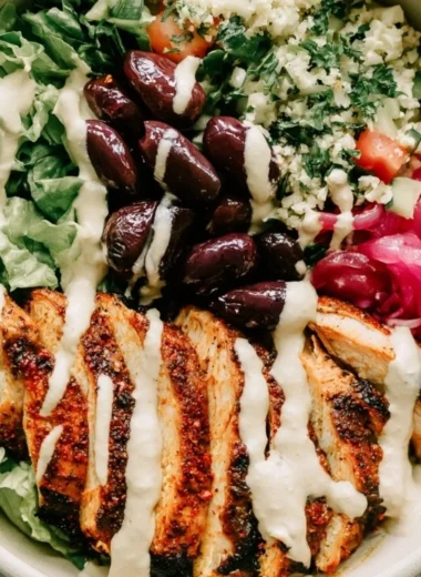 Cozy chicken shawarma meal prep bowls with colorful vegetables and spices