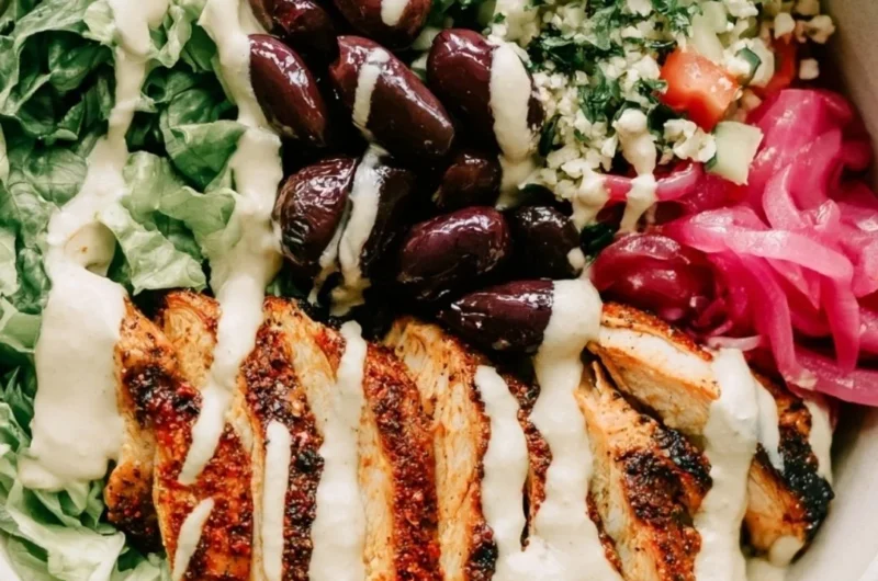 Cozy chicken shawarma meal prep bowls with colorful vegetables and spices