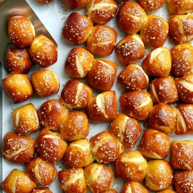 Freshly baked cozy homemade pretzel bites served with dipping sauce.