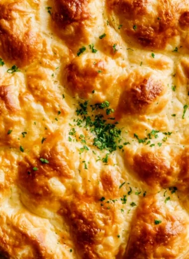 Homemade Dutch Oven Chicken Pot Pie with golden crust and vegetables