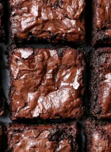 Decadent fudgiest brownies in a cozy setting, perfect for chocolate lovers.
