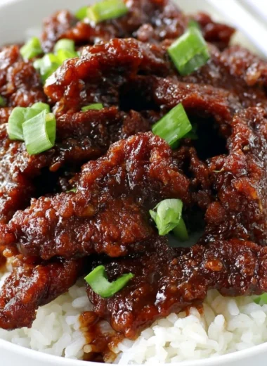 Gluten Free 30-Minute Mongolian Beef served on a plate with vegetables