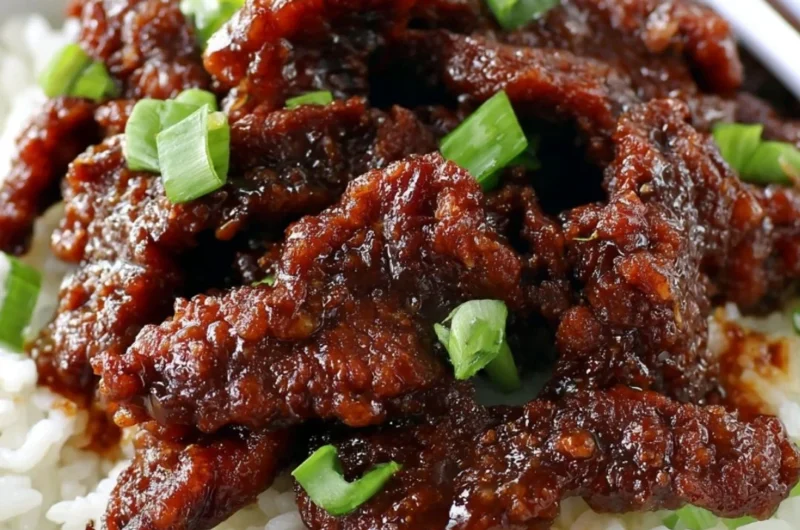 Gluten Free 30-Minute Mongolian Beef served on a plate with vegetables