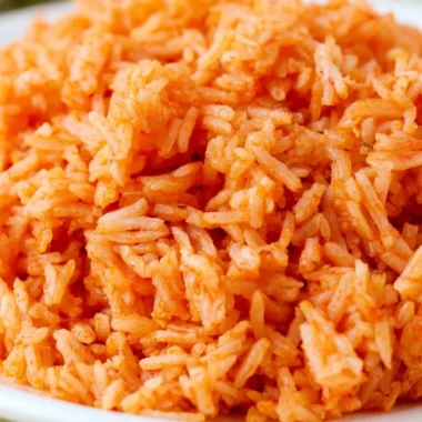 Bowl of quick and easy Spanish rice garnished with herbs
