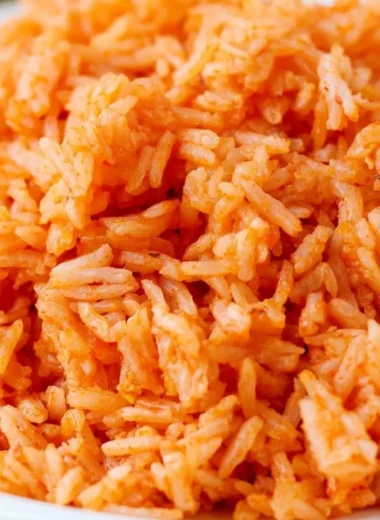 Bowl of quick and easy Spanish rice garnished with herbs
