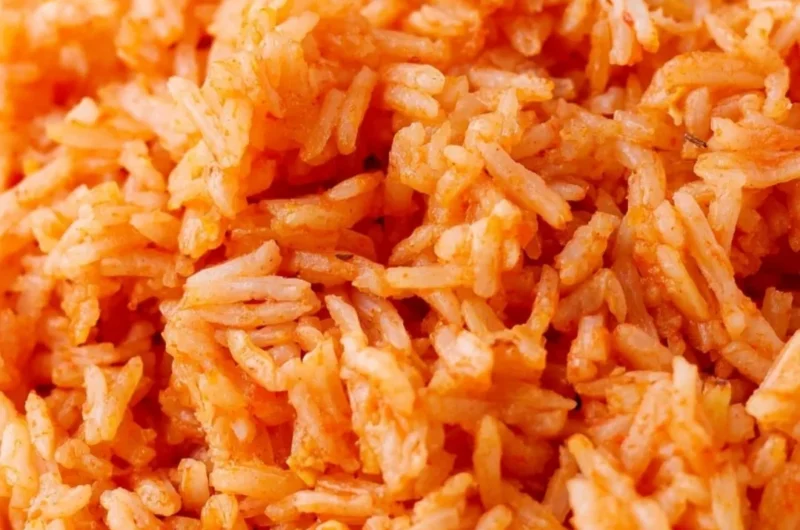 Bowl of quick and easy Spanish rice garnished with herbs