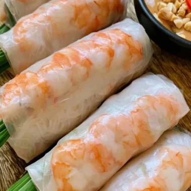 Fresh Vietnamese spring rolls with vegetables and shrimp on a platter