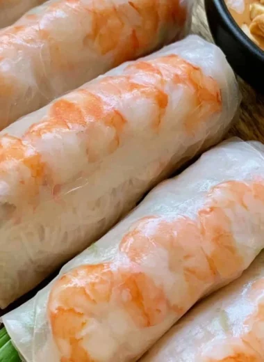 Fresh Vietnamese spring rolls with vegetables and shrimp on a platter
