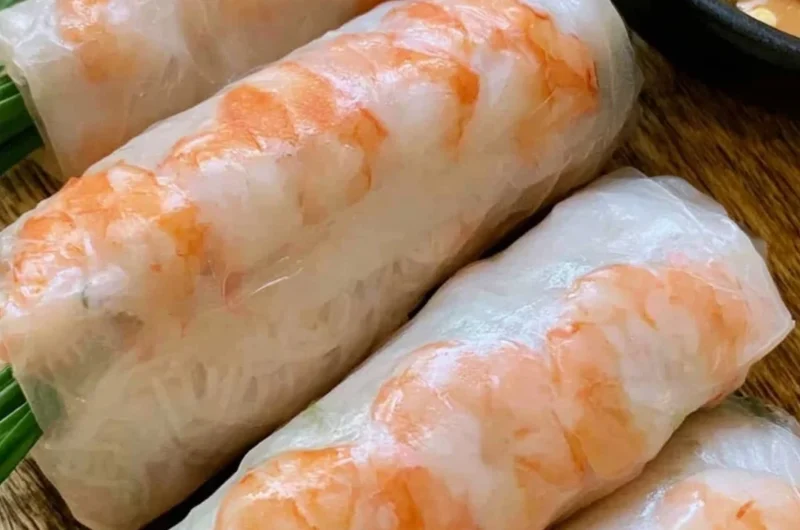 Fresh Vietnamese spring rolls with vegetables and shrimp on a platter